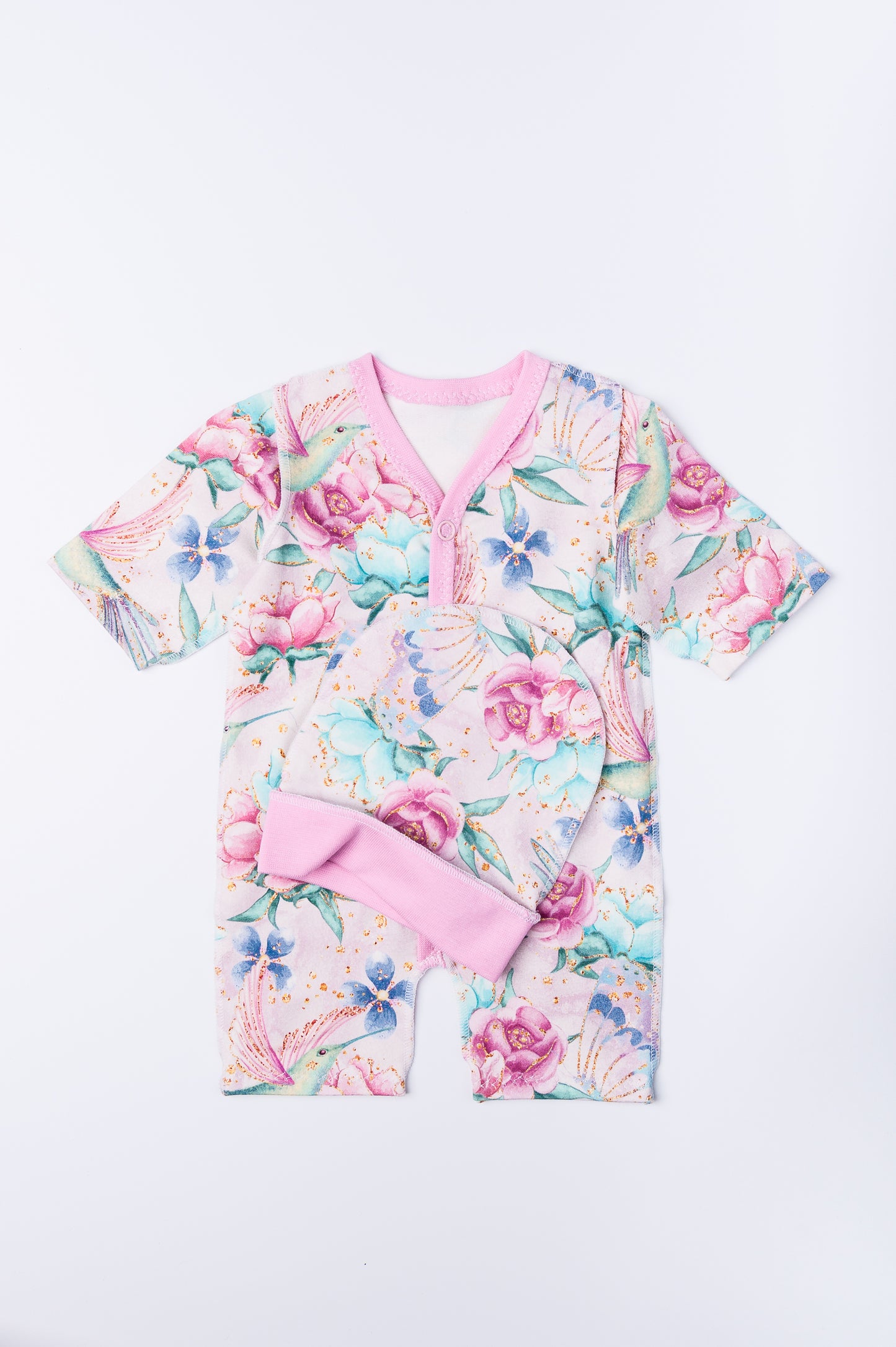 Komplektiņš “Ziedu sapnis” 44–46 — slīpiņš ar atvērtām rociņām un kājiņām